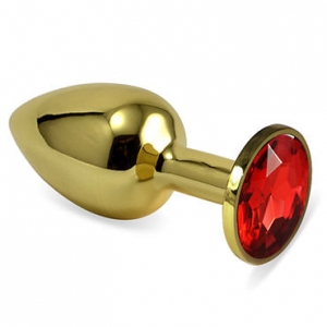 Пробка металлическая, золотая, крупная с красным большим кристаллом.